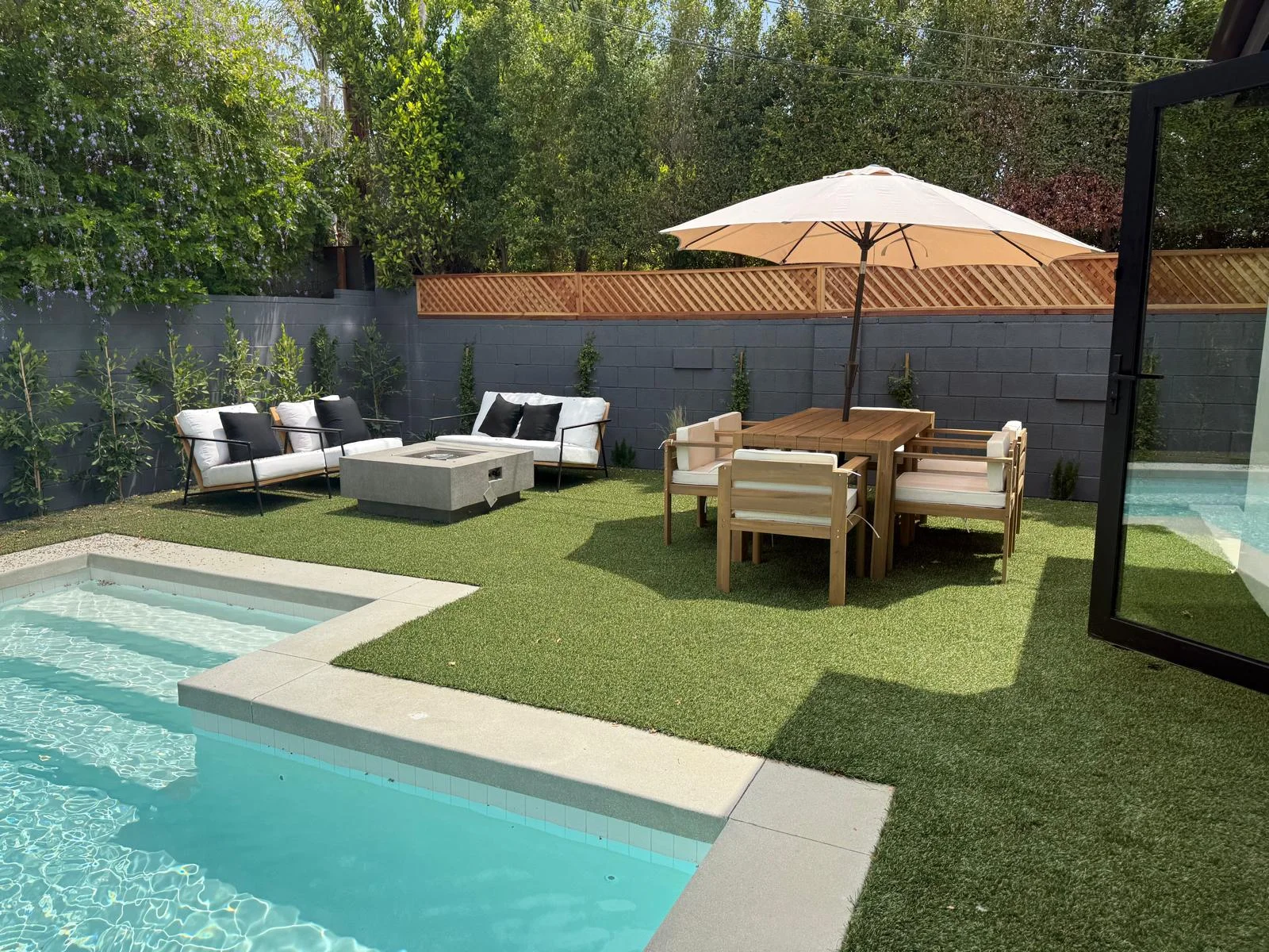 artificial grass installation Woodland Hills backyard at twilight